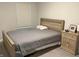 Bedroom showcases a bed with a light wood frame, a covered mattress, and a nightstand at 17364 Graley Pl, Westfield, IN 46074