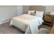 Light, bright, and airy bedroom with bedside table and upholstered headboard at 17364 Graley Pl, Westfield, IN 46074