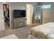 Spacious bedroom with a walk-in closet and a large mirror reflecting the bed at 17364 Graley Pl, Westfield, IN 46074