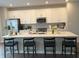 A kitchen featuring white cabinets, stainless steel appliances, and an island with bar seating at 17364 Graley Pl, Westfield, IN 46074
