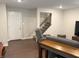 Open living area with chair, sofa and tv set on wood-look floors near the staircase at 17364 Graley Pl, Westfield, IN 46074