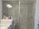 Close up of tiled shower with glass door featuring a shower head and tiled bench at 17364 Graley Pl, Westfield, IN 46074