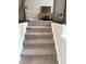 Carpeted staircase with modern railings leads to the upper level living spaces at 17364 Graley Pl, Westfield, IN 46074