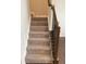 Carpeted staircase with decorative railing offering access to the upper level of the home at 17364 Graley Pl, Westfield, IN 46074
