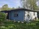 Single-story home featuring light blue siding and a well-maintained roof at 1817 Sparrow Ave, Indianapolis, IN 46227