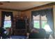 Cozy living room featuring a TV, windows with curtains, and a comfortable chair at 1817 Sparrow Ave, Indianapolis, IN 46227