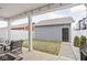 Charming backyard patio area, complete with a detached garage, grassy area, and string lights for outdoor enjoyment at 214 Handley St, Indianapolis, IN 46222