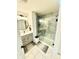 Beautifully renovated bathroom features a glass walk-in shower, modern vanity and upgraded fixtures at 214 Handley St, Indianapolis, IN 46222