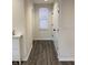 Well-lit hallway featuring stylish flooring, neutral walls, and ample closet space, enhancing functionality and appeal at 214 Handley St, Indianapolis, IN 46222