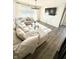 Comfortable living room with an L-shaped couch, a glass table and a flat screen TV at 214 Handley St, Indianapolis, IN 46222