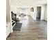 Bright open-concept living room featuring gray-toned flooring and contemporary decor at 214 Handley St, Indianapolis, IN 46222