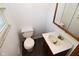 This bathroom features a standard toilet, white sink, and vanity at 2220 Radcliffe Ave, Indianapolis, IN 46227