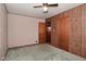 Standard bedroom featuring paneled walls, neutral paint, and ceiling fan with overhead lighting at 2220 Radcliffe Ave, Indianapolis, IN 46227