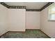 Carpeted floors and neutral walls characterize this bedroom at 2220 Radcliffe Ave, Indianapolis, IN 46227