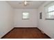 This room has hardwood floors, white walls and ceiling fan with overhead lighting at 2220 Radcliffe Ave, Indianapolis, IN 46227