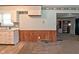 View of a kitchen area showcasing cabinets, wood paneling and tiled flooring at 2220 Radcliffe Ave, Indianapolis, IN 46227