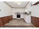 Functional kitchen featuring white cabinets, modern appliances, and tiled flooring at 2220 Radcliffe Ave, Indianapolis, IN 46227