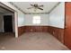 Living room featuring a ceiling fan, wood trim and carpet flooring at 2220 Radcliffe Ave, Indianapolis, IN 46227