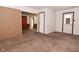 Open-concept living room featuring doorway to exterior and doorways to other rooms at 2220 Radcliffe Ave, Indianapolis, IN 46227