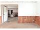 View of a living room leading to a bonus room with a brick fireplace at 2220 Radcliffe Ave, Indianapolis, IN 46227