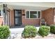 Cozy front porch with brick accents, decorative ironwork, and a comfortable seating area at 2220 Radcliffe Ave, Indianapolis, IN 46227