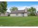 Backyard with a large lawn and patio doors at 308 Creekstone Ct, Indianapolis, IN 46239