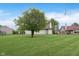 Spacious backyard with a mature tree and well-maintained lawn at 308 Creekstone Ct, Indianapolis, IN 46239