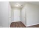 Entry hallway featuring new flooring, neutral wall color and multiple doors at 308 Creekstone Ct, Indianapolis, IN 46239