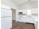 Bright kitchen features white appliances, ample cabinet space, and modern finishes at 308 Creekstone Ct, Indianapolis, IN 46239
