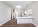 Spacious kitchen with breakfast bar, white cabinetry, and modern appliances at 308 Creekstone Ct, Indianapolis, IN 46239