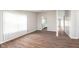 Bright living room with hardwood floors, neutral paint and natural light from a large front window at 308 Creekstone Ct, Indianapolis, IN 46239