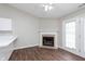 Open concept living room features a fireplace and access to the backyard at 308 Creekstone Ct, Indianapolis, IN 46239