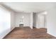 Bright living area with wood floors, light gray walls, and a view into the open kitchen at 308 Creekstone Ct, Indianapolis, IN 46239