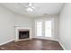 Cozy living room featuring a fireplace, ceiling fan, and access to outdoor space at 308 Creekstone Ct, Indianapolis, IN 46239
