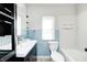 Bathroom featuring a vanity, toilet, and shower-tub combination at 333 N Jefferson St, Brownsburg, IN 46112