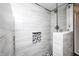 Modern tiled shower with glass door and built in niche offers a spa-like experience at 333 N Jefferson St, Brownsburg, IN 46112