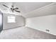 Sunlit bedroom with carpet, fan, and window provides a serene and inviting space at 333 N Jefferson St, Brownsburg, IN 46112