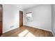 Bright bedroom with hardwood floors, neutral walls, and a closet at 333 N Jefferson St, Brownsburg, IN 46112