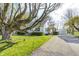 Charming home showcasing a well-maintained lawn, mature trees, detached garage, and a cozy front porch at 333 N Jefferson St, Brownsburg, IN 46112