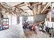 Garage interior featuring an open ceiling, lawn mower and ample storage at 333 N Jefferson St, Brownsburg, IN 46112