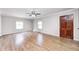 Bright living room featuring hardwood floors, ample natural light, and a ceiling fan at 333 N Jefferson St, Brownsburg, IN 46112