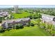 Sprawling community with manicured lawns, mature trees, nearby highway, and a prominent water tower at 3546 Golden Gate N Dr, Carmel, IN 46074