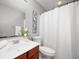 Neutral bathroom features a white shower curtain, vanity, and chrome fixtures adding a modern touch at 3546 Golden Gate N Dr, Carmel, IN 46074
