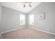 Cozy bedroom with neutral walls, a ceiling fan, and bright windows providing natural light at 3546 Golden Gate N Dr, Carmel, IN 46074