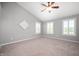 Bright Primary bedroom featuring high ceilings and plush carpet, creating a comfortable and relaxing space at 3546 Golden Gate N Dr, Carmel, IN 46074