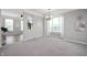 Elegant dining room with carpeted floors, modern lighting, and gray walls at 3546 Golden Gate N Dr, Carmel, IN 46074