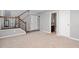 Neutral foyer featuring carpeted floors, stairs with decorative railing, and gray walls at 3546 Golden Gate N Dr, Carmel, IN 46074