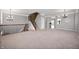Spacious carpeted living room featuring stairs and light gray walls at 3546 Golden Gate N Dr, Carmel, IN 46074