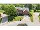 A lovely brick home with a large manicured lawn and mature trees in a peaceful cul-de-sac neighborhood at 3601 Lakeshore Ct, Greenwood, IN 46143
