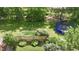 Aerial view of a backyard, fence, and a trampoline at 3601 Lakeshore Ct, Greenwood, IN 46143